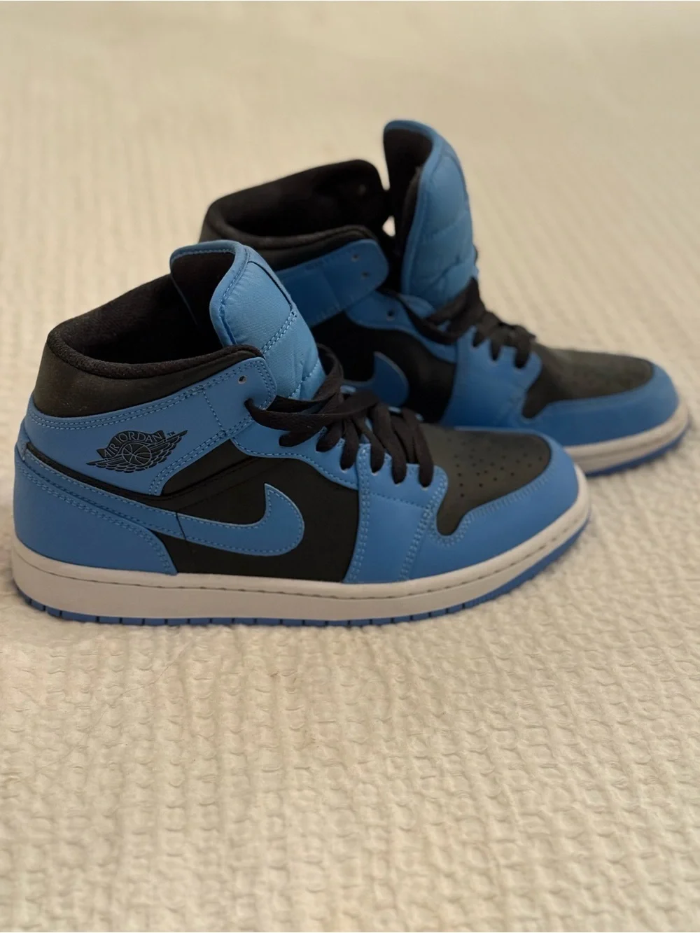 Jordan Men’s High-Top Sneakers in University Blue and Black